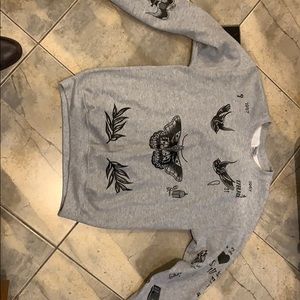 Harry Styles’ tattoo themed sweatshirt